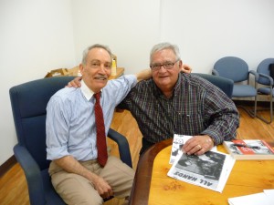 Author with book fan at table