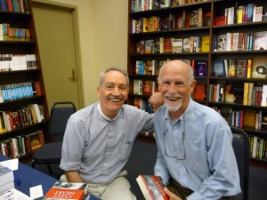 Man seated with author, holding Cleft Heart