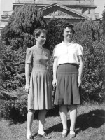 Two 20-something women standing in front of campus building at U. of Washington