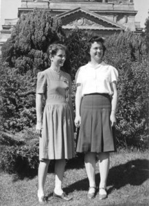 Two 20-something women standing in front of campus building at U. of Washington