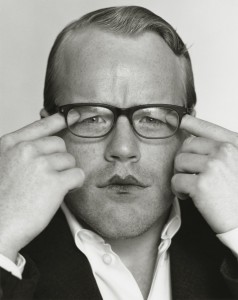 A young Philip Seymour Hoffman pulls eyelids down under his glasses