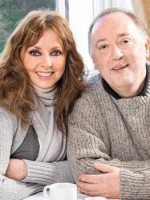 UK Star Carol & her cleft lipped brother sitting close to ea other at table