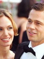Angelina Jolie gazes at Brad Pitt
