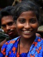 Bangladeshi woman with a smile that defies "lookism.".