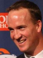 Peyton Manning out of uniform smiling.