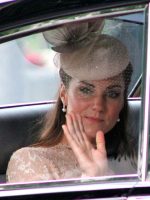 Plastic surgery ideal: Duchess of Cambridge with hat on waving from a car.