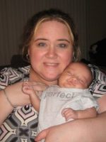 Bust shot of Michelle Aftimos and "Perfect" baby son with cleft lip.