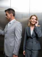 Male and female showing male privilege in elevators.