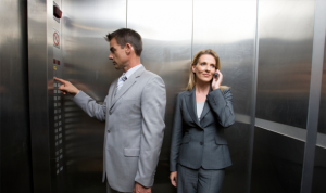 Male and female showing male privilege in elevators.
