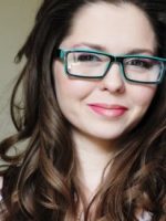 Headshot of brunette Amber Rose Carlson in glasses, who addresses her rapist and the sentence he deserves.